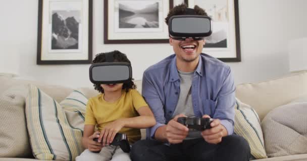 Happy Biracial Man His Son Playing Video Games Wearing Headsets — Stock Video