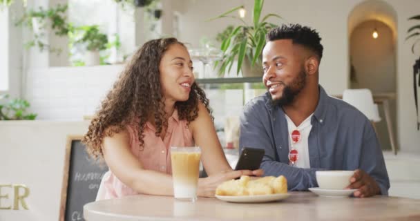 Happy Diverse Couple Spending Time Together Cafe Drinking Coffee Using — Stock Video