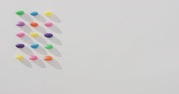 Video Overhead View Rows Multi Coloured Sweets Copy Space White — Stock Video