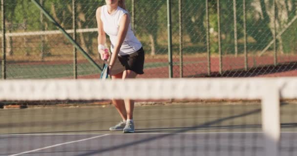 Video Focused Caucasian Female Tennis Player Holding Racket Hitting Ball — Stock Video