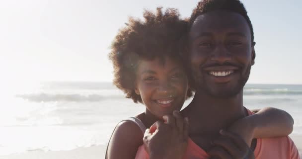 Portrait Smiling African American Couple Embracing Sunny Beach Healthy Active — Vídeos de Stock