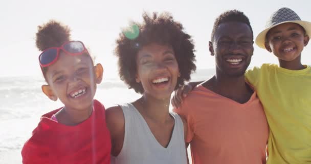 Portrait Smiling African American Family Embracing Sunny Beach Healthy Active — Vídeo de stock