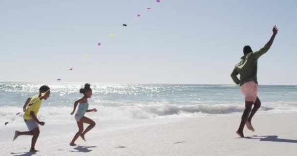 Smiling African American Family Running Flying Kite Sunny Beach Healthy — Video Stock