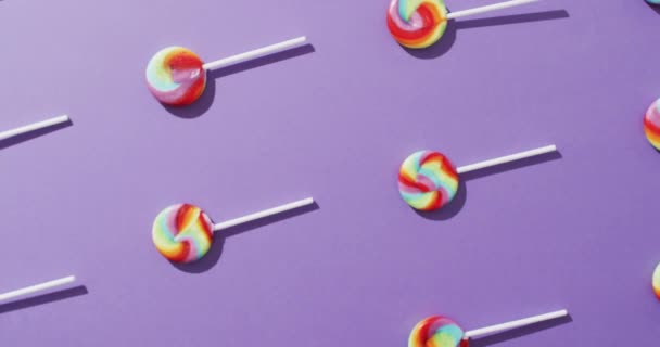 Video Rows Multicoloured Lollipops Blue Background Colourful Fun Food Candy — Vídeos de Stock