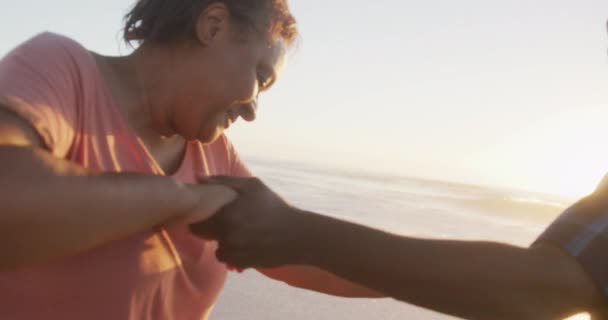 Smiling Senior African American Couple Holding Hands Dancing Sunny Beach — Stock Video