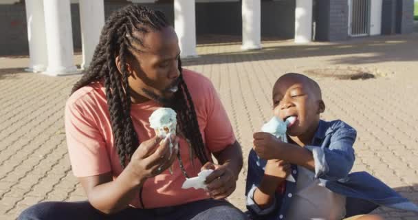 Video Happy African American Father Son Eating Ice Creams Sunny — Stockvideo
