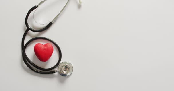 Video Close Stethoscope Heart Blue Background Global Medicine Healthcare Concept — Vídeo de Stock