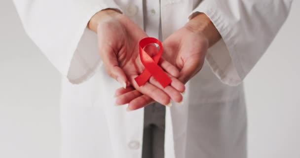 Video Biracial Female Doctor Holding Orange Kidney Cancer Ribbon Global — Vídeo de Stock