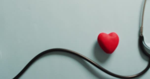 Video Close Stethoscope Heart Blue Background Global Medicine Healthcare Concept — Vídeo de Stock