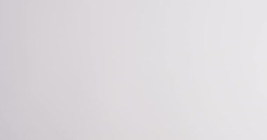 Video of hands of caucasian woman holding red ribbon on white background. medicine, health, cancer awareness concept digitally generated video.