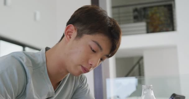 Asian Male Teenager Sitting Table Smartphone Having Breakfast Spending Time — Stock videók