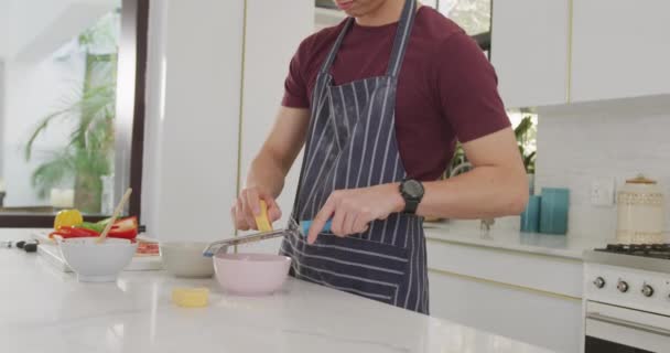 Asian Male Teenager Preparing Food Wearing Apron Kitchen Spending Time — 图库视频影像