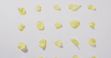 Close up of potato chips with copy space on white surface. food and snack concept