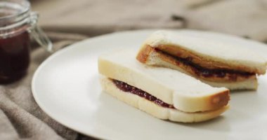 Close up of peanut butter and jelly sandwiches in a plate. food and nutrition concept