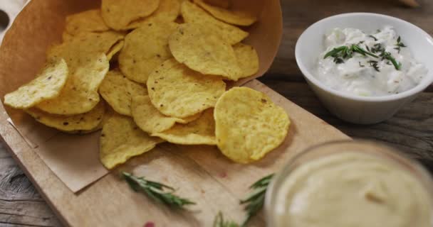 Close Potato Chips Sauces Wooden Tray Black Surface Food Snack — Vídeo de Stock