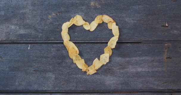 Potato Chips Forming Heart Shape Copy Space Wooden Surface Food — Vídeos de Stock