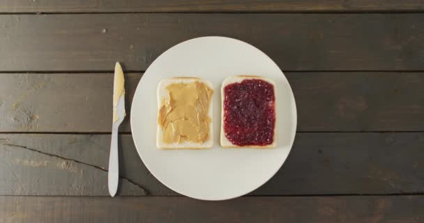 Close View Peanut Butter Jelly Sandwiches Plate Butter Knife Wooden — Video Stock