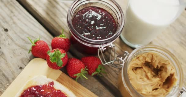 Peanut Butter Jelly Sandwiches Wooden Tray Milk Strawberries Wooden Surface — Wideo stockowe