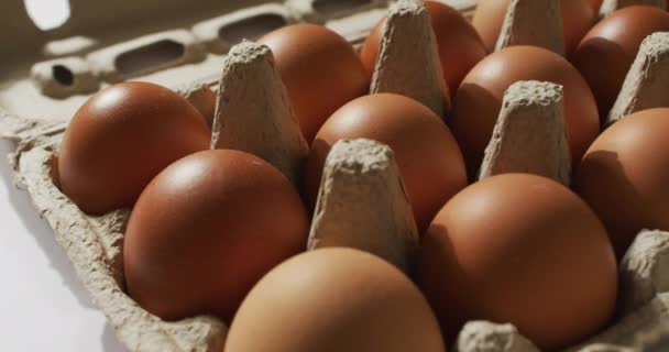 Close Multiple Eggs Cardboard Box White Surface Food Nutrition Concept — Stock videók