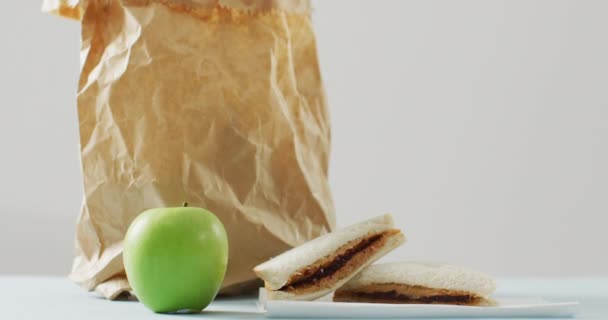 Peanut Butter Jelly Sandwiches Apple Paper Bag White Background Food — Vídeos de Stock
