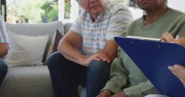 Senior diverse people at meeting talking at retirement home. healthy, active retirement and body inclusivity.