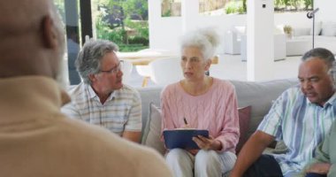 Senior diverse people at meeting talking at retirement home. healthy, active retirement and body inclusivity.