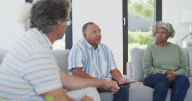 Senior diverse people at meeting talking at retirement home. healthy, active retirement and body inclusivity.