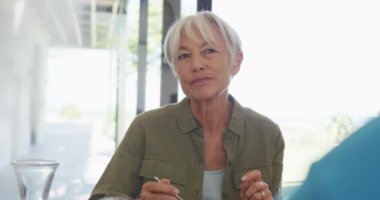 Happy senior diverse people having breakfast at retirement home. healthy, active retirement and body inclusivity.