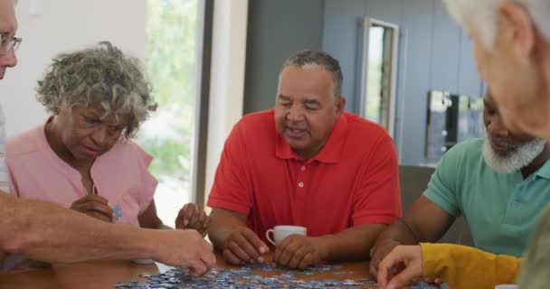 Happy Senior Diverse People Playing Puzzle Table Retirement Home Healthy — Wideo stockowe