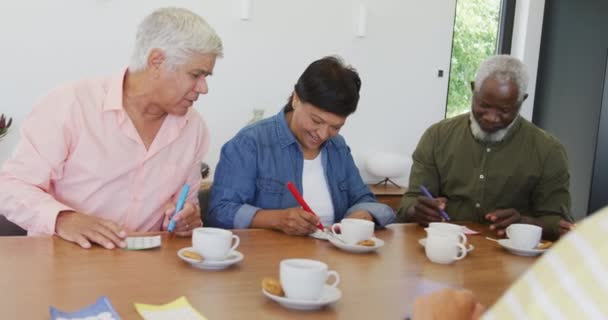 Happy Senior Diverse People Drinking Tea Playing Bingo Retirement Home — Stock Video