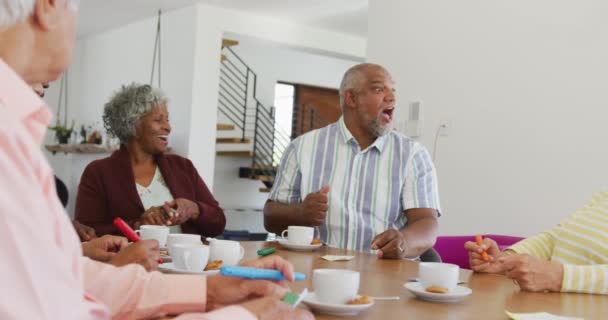 Happy Senior Diverse People Drinking Tea Playing Bingo Retirement Home — Stockvideo