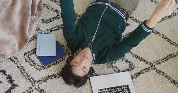 Overhead View Asian Boy Playing Basketball Lying Floor Home Teenager — Vídeos de Stock