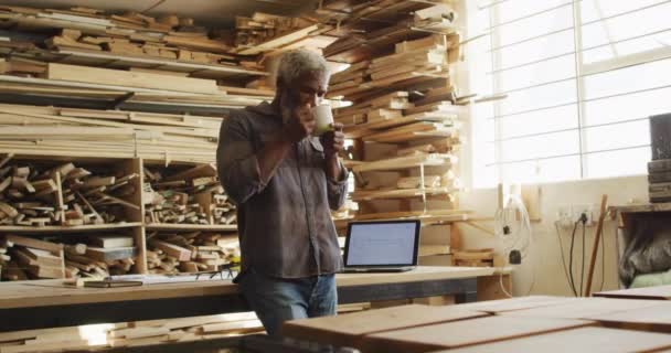 African American Male Carpenter Drinking Coffee Carpentry Shop Carpentry Craftsmanship — Stockvideo
