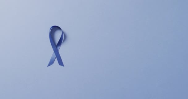 Video Dark Blue Colon Cancer Ribbon Pale Blue Background Medical — ストック動画