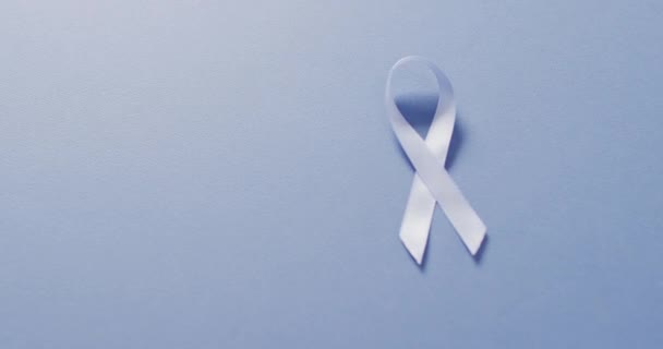 Video Pale Blue Prostate Cancer Ribbon Blue Background Medical Healthcare — Stockvideo