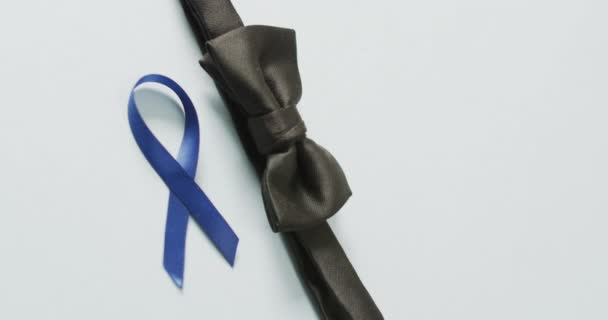 Video Black Bow Tie Dark Blue Colon Cancer Ribbon Pale — ストック動画