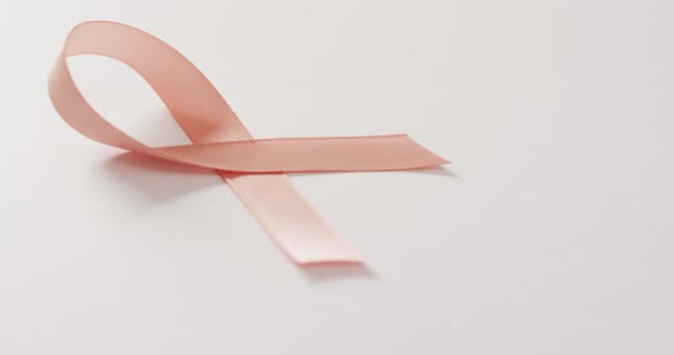 Video Peach Pink Uterine Cancer Ribbon White Background Medical Healthcare — Stock Video
