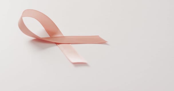 Video Peach Pink Uterine Cancer Ribbon White Background Medical Healthcare — Vídeo de Stock