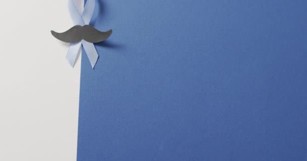 Video Paper Moustache Pale Blue Prostate Cancer Ribbon White Blue — 图库视频影像