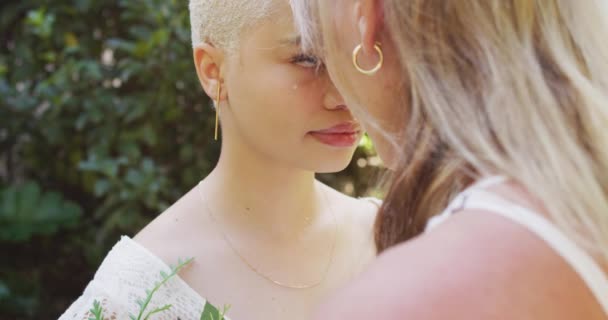 Happy Diverse Female Couple Holding Hands Touching Foreheads Garden Wedding — Stock Video
