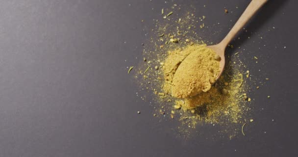Video Spoon Tumeric Seasoning Lying Grey Surface Cooking Seasonings Spices — Stock Video