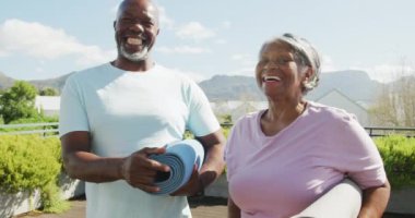  happy senior american african couple exercising. Retirement lifestyle, spending time alone,active leisure time.