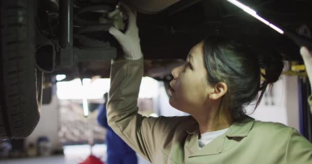 Video Biracial Female Car Mechanic Checking Car Working Car Repair — Stock Video