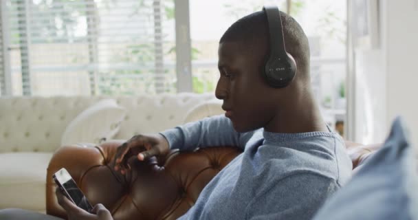 African American Man Using Headphones Listening Music Domestic Life Using — Video Stock