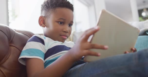 Video Happy African American Boy Sitting Sofa Using Tablet Childhood — Vídeos de Stock