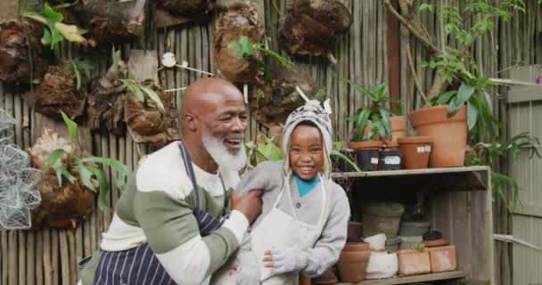 Portrait Happy Senior African American Man His Grandson Embracing Smiling — Stock video