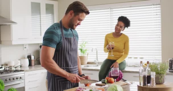 Video Happy Diverse Couple Preparing Meal Drinking Wine Having Fun — Video Stock