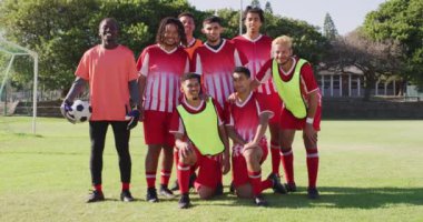 Video of diverse group of male football players. Male football team, inclusivity and fitness in team sports.