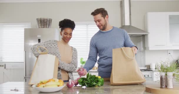 Video Happy Diverse Couple Unpacking Groceries Kitchen Love Relationship Spending — Vídeos de Stock