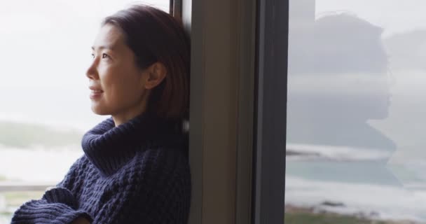 Happy Asian Woman Wearing Pullover Relaxing Thinking Window Alone Spending — Vídeo de Stock